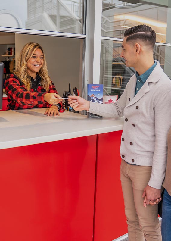 Guests receive tickets at the Flyover Canada ticket counter.